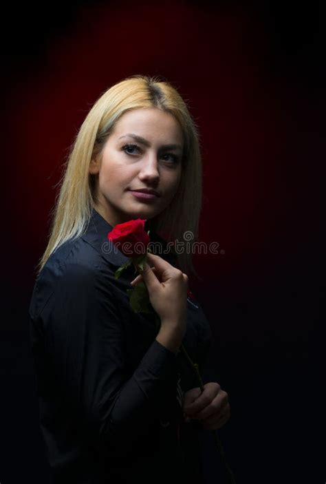 Portrait Of A Beautiful Blonde Girl With A Red Rose In Her Hand Stock Image Image Of Elegance