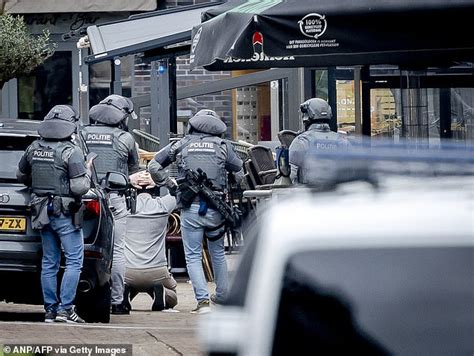 Netherlands Hostage Incident Masked Man Puts His Hands In The Air And