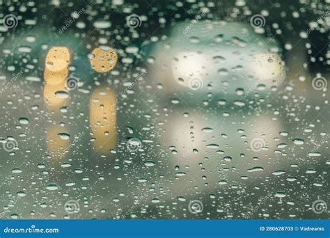 Rainy City Background Blurred Shape Of Car With Headlights Seen From