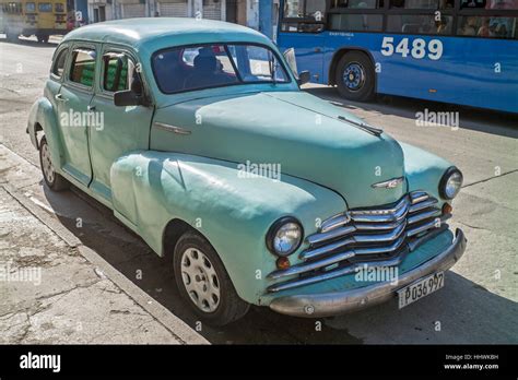 Pedestrian Walks Past Mint Green American Car Old Havana Cuba Stock