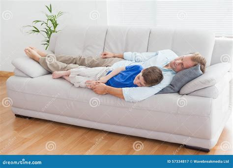 Father And Son Using Napping On The Couch Stock Image Image Of Adult