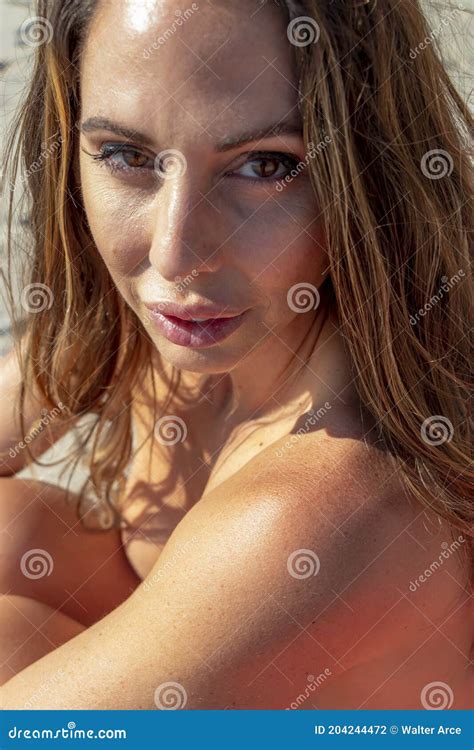 Lovely Brunette Bikini Model Relaxing On The Beach Stock Photo Image