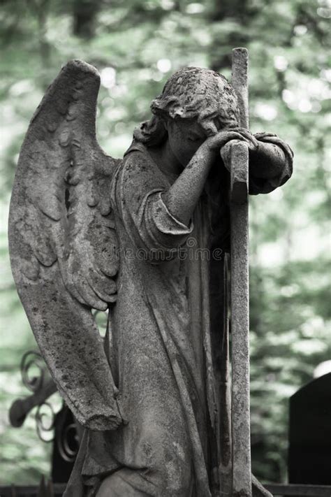 The Sorrowful Angel Weeping Angel With A Cross Stock Photo Image Of