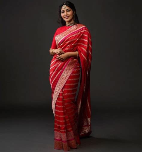 Aishwarya Lekshmi S Radiant Look In A Red Benarsi Saree At Ponniyin