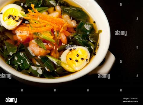 Traditional Japanese Miso Soup With Seaweed And Fish Close Up Top