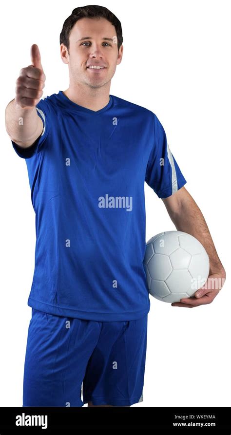 Handsome Football Player Holding The Ball On White Background Stock