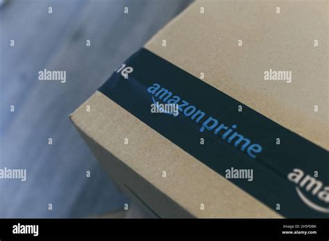 Boxes with Amazon logo on the floor. Order on delivery. Christmas gifts in cardboard box ready ...