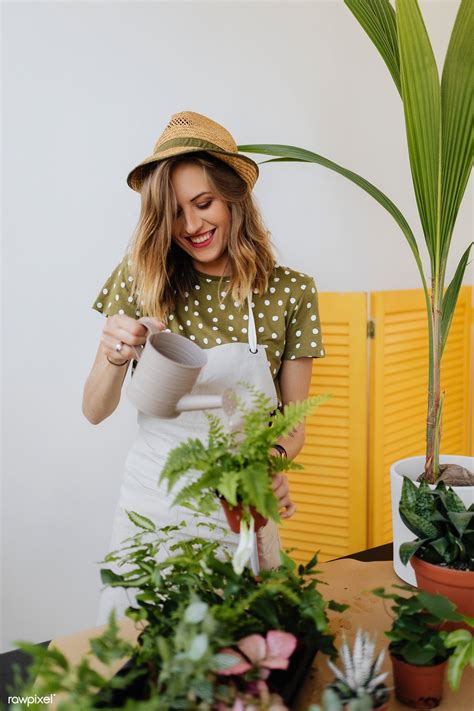 Cheerful Woman Watering Her Houseplants Premium Image By Rawpixel