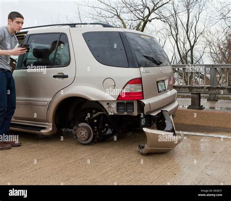 Missing wheel on car at an accident scene - USA Stock Photo - Alamy