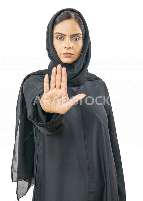 Portrait Of An Arab Emirati Gulf Woman Wearing Abaya And Hijab Gestures Of Two Hands Indicating