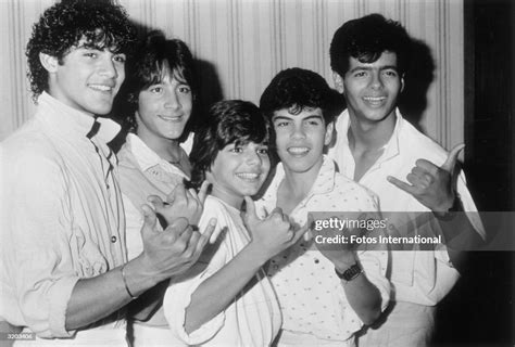 Portrait Of The Teen Pop Group Menudo Gesturing With Their Hands