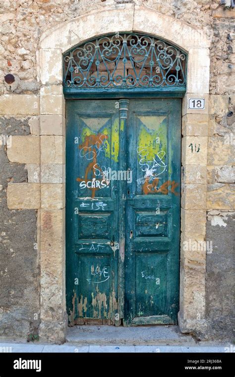 Old Weathered Wooden Door With Amazing Stone Arched Lintel At An