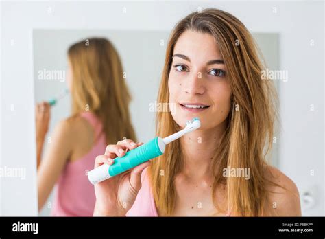 Woman Brushing Her Teeth Stock Photo Alamy