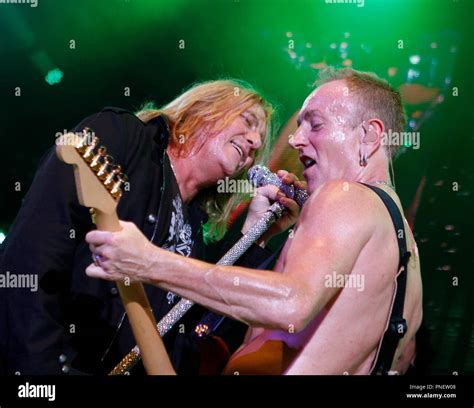 Phil Collen And Joe Elliott With Def Leppard Perform In Concert At The Cruzan Amphitheater In