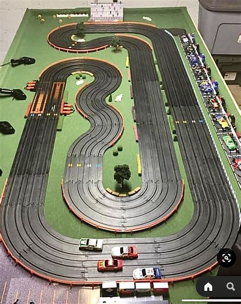 A Toy Track With Cars And Trucks On It