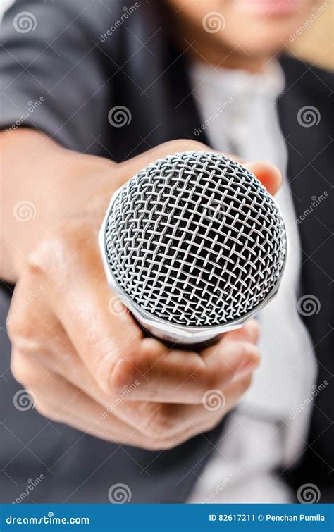 Hand holding a microphone. stock image. Image of interview - 82617211