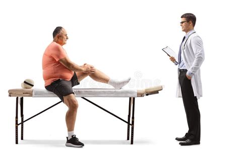 Mature Corpulent Man With A Painful Knee Sitting On A Massage Bed And