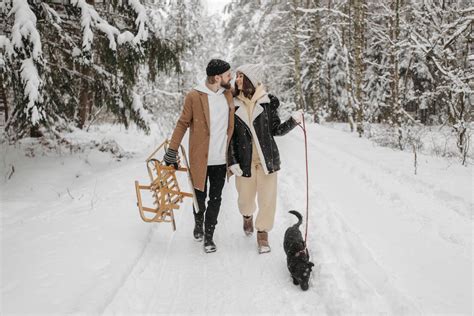 A Couple Walking Their Pet Dog during Winter · Free Stock Photo