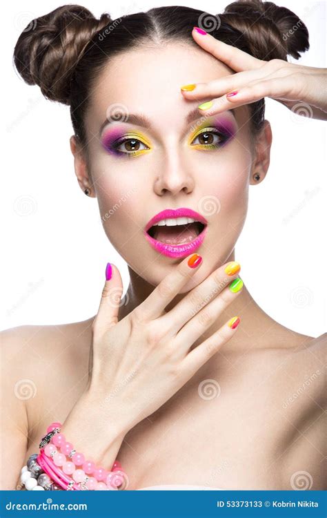 Beautiful Model Girl With Bright Colored Makeup And Nail Polish In The