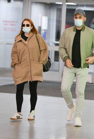 Lindsay Lohan With Husband Bader Shammas Catch A Flight Out Of New