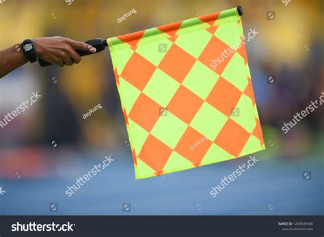 Assistant Referee Hold Flag Offside Signal Stock Photo 1209639568