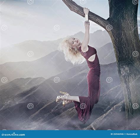 Attractive Blonde Lady Hanging On A Tree Stock Photo Image Of Extreme Hillside