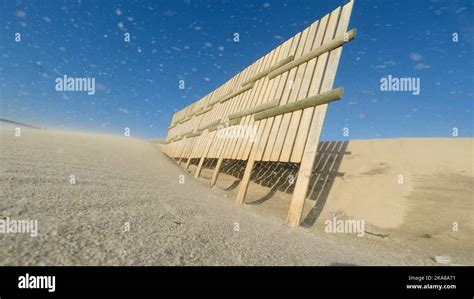 Sand dunes formation during a windy afternoon on the beach Stock Photo ...