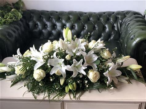 White Lily And Rose Casket Spray Funeral Flowers Southend