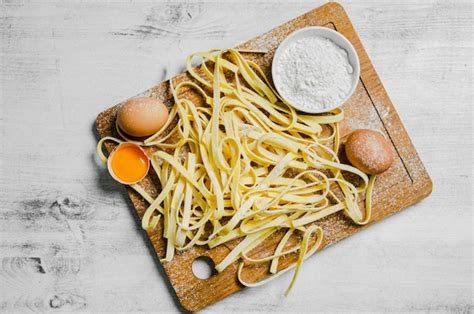 Premium Photo Homemade Pasta Tagliatelle On A White Table