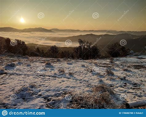 Hill Station Area with Clouds, Snow and Sunrise Stock Photo - Image of ...