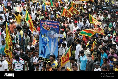 Sri Lankan Cricket Fans Carry Sri Lankan Flags And A Poster Of Muttiah