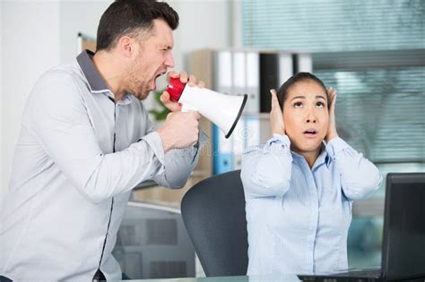 Boss Shouting Through Megaphone At Office Worker Stock Image Image Of