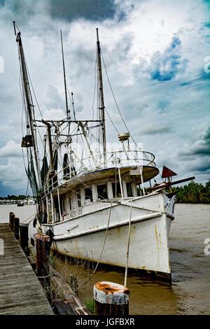 Louisiana, Iberia Parish, Delcambre Canal aka Bayou Carlin, commercial fishing boat sunk at dock ...