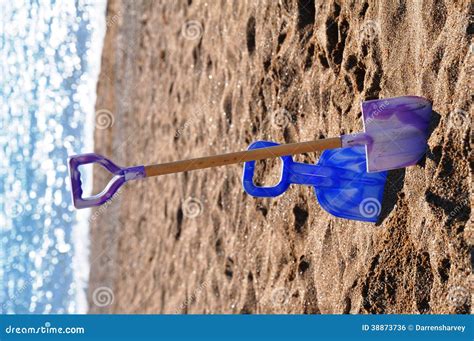 Childrens Spades On A British Beach Stock Photo Image Of Beach Tools