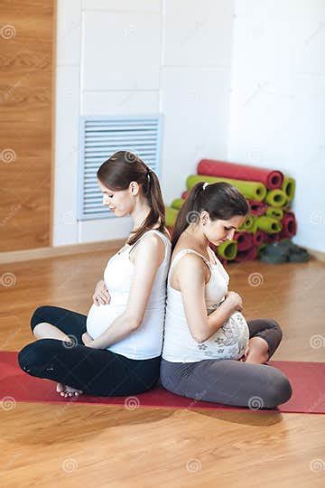 Pregnancy Yoga Fitness Concept Portrait Of Two Attractive Young