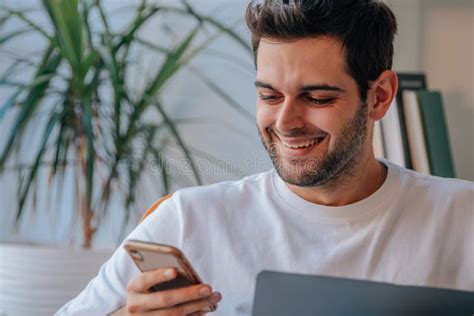 Man At Home Working With Laptop And Mobile Stock Image Image Of