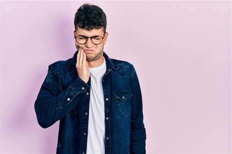 Premium Photo Young Hispanic Man Wearing Casual Clothes And Glasses