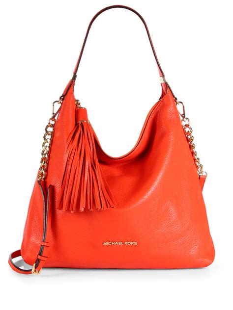 Lyst Michael Michael Kors Large Tassel Shoulder Bag In Orange