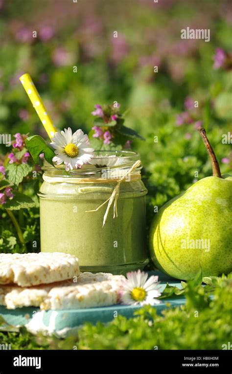 Green Smoothie With Edible Flowers And Fruits Hi Res Stock Photography