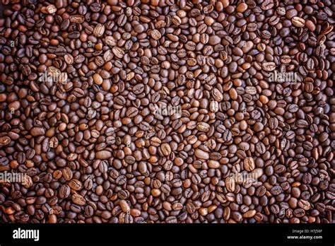 Coffee beans brown background Stock Photo - Alamy