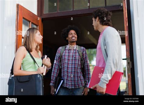 Students talking on campus Stock Photo - Alamy