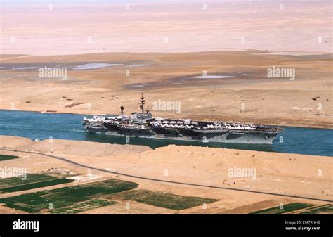 An aerial starboard view of the aircraft carrier USS AMERICA (CV 66) during its transit through ...