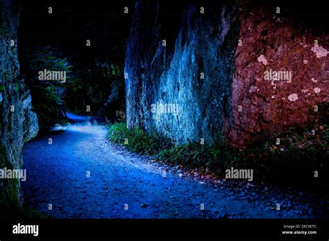 A Road Into The Unknown A Mysterious Gravel Road Between The Rocks And