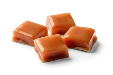Premium Photo Close Up Of Melted Toffee Caramel Candies On White
