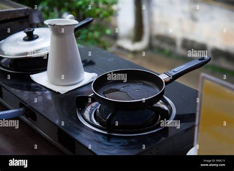 Heating Oil In Stainless Steel Pan On Gas Fueled Stove Prepared For