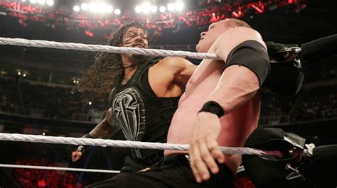 Two Men Wrestling In An Arena With One Holding On To The Other S Arm