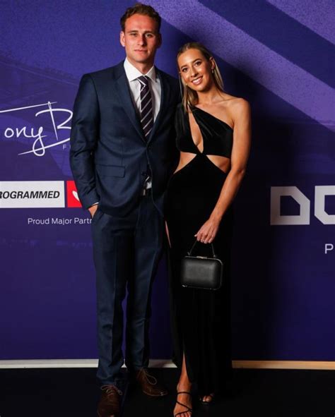 Fremantle Dockers players, coaches and partners hit the purple carpet ...