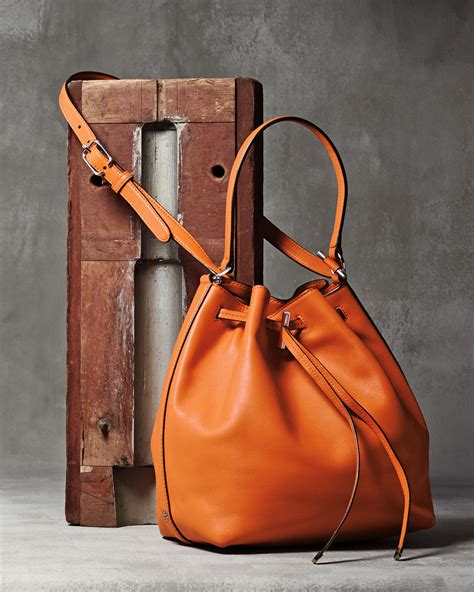 Tory burch Toggle Drawstring Leather Bucket Bag in Orange | Lyst