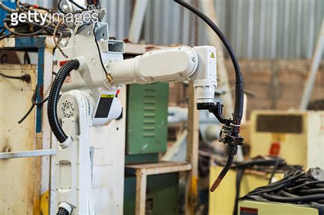 Robotic Arm Ready For Work At Production Line In Smart Factory