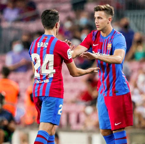 Two Soccer Players Shake Hands On The Field